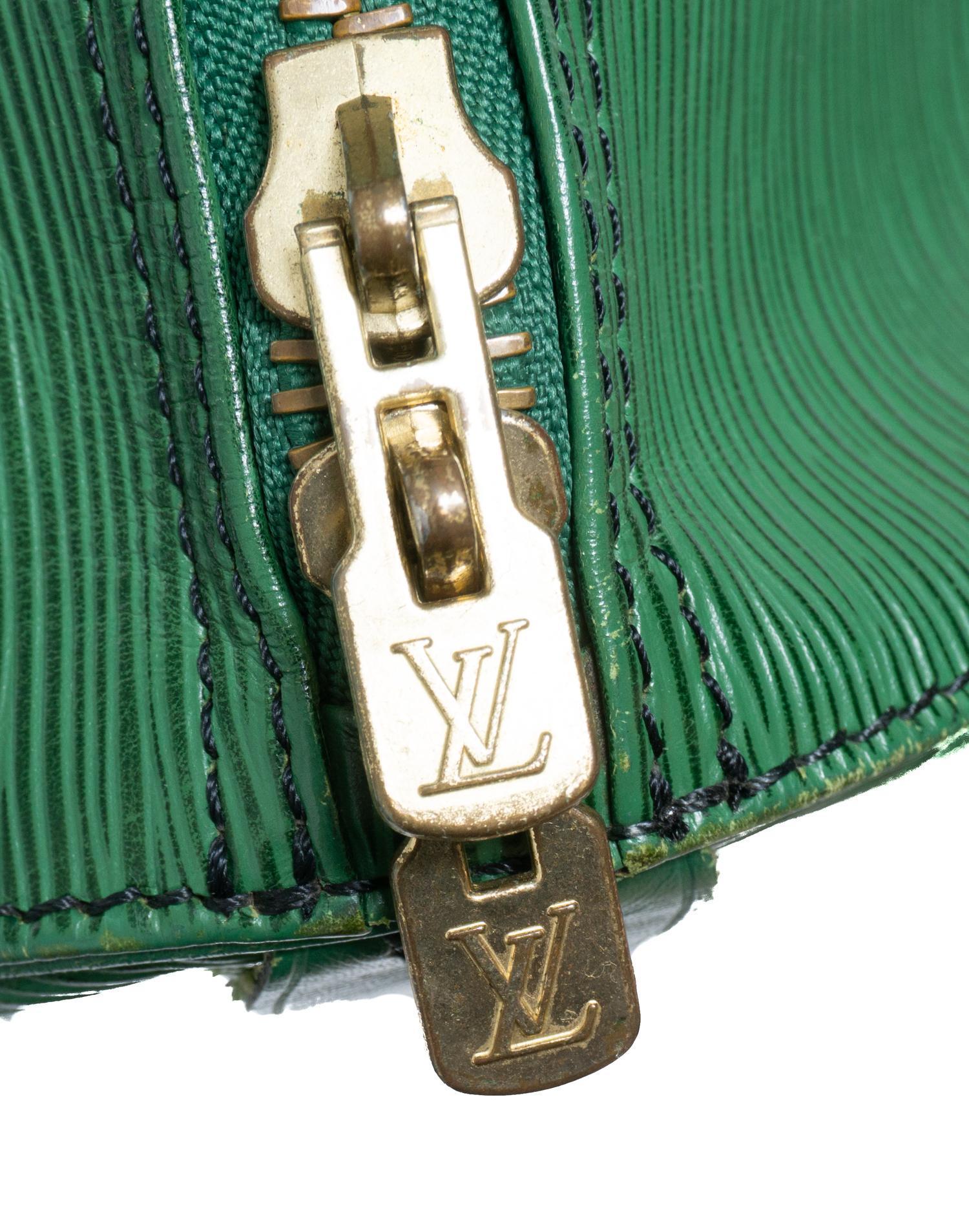 Sold at Auction: A Twin Handled Duffle Bag Marked Louis Vuitton