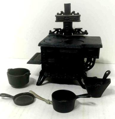 Sold at Auction: Crescent Miniature cast iron Fuel Stove with Pots