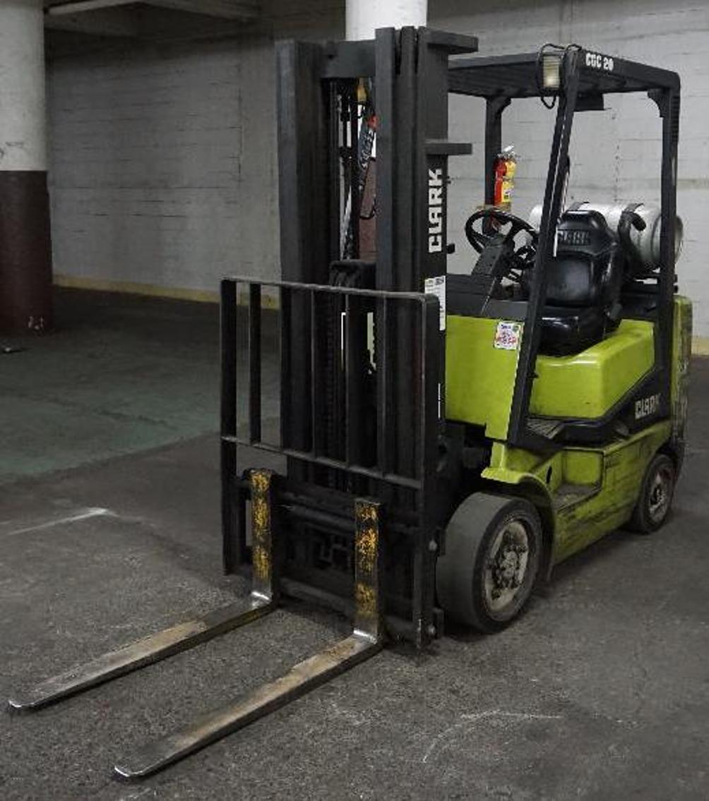 (8) Electric Pallet Jacks, Clark Forklift, Tennant Sweeper, and Pallet Racking