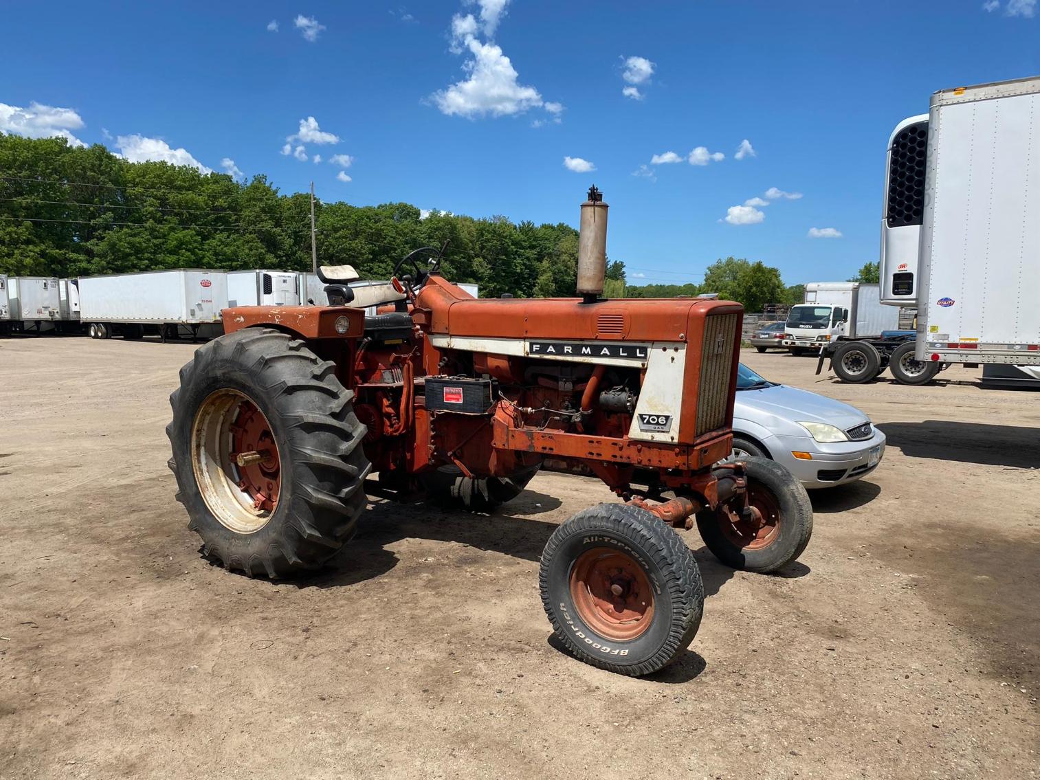 Farmall 706 Gas Tractor, Larson 14' Boat, Air Compressors, Trucking Parts and Accessories