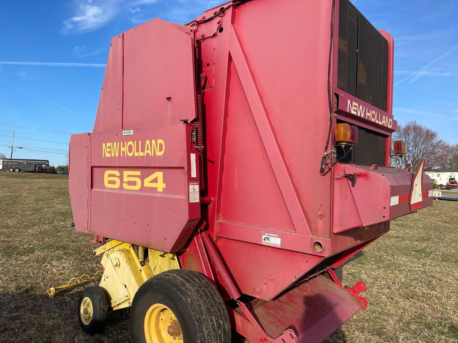 Image for New Holland 654 Round Baler, 6 ft Bale w/ bale monitor. Per seller: String wrap may need repair , 