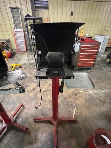 Electric bench grinder on stand with cover