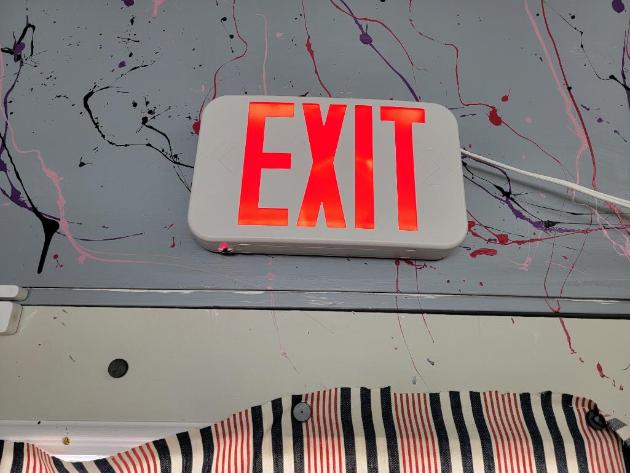 Two Regulation Lighted Exit Signs