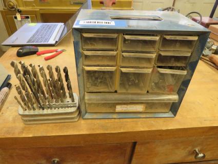 lot-of-drill-bits-in-cabinet