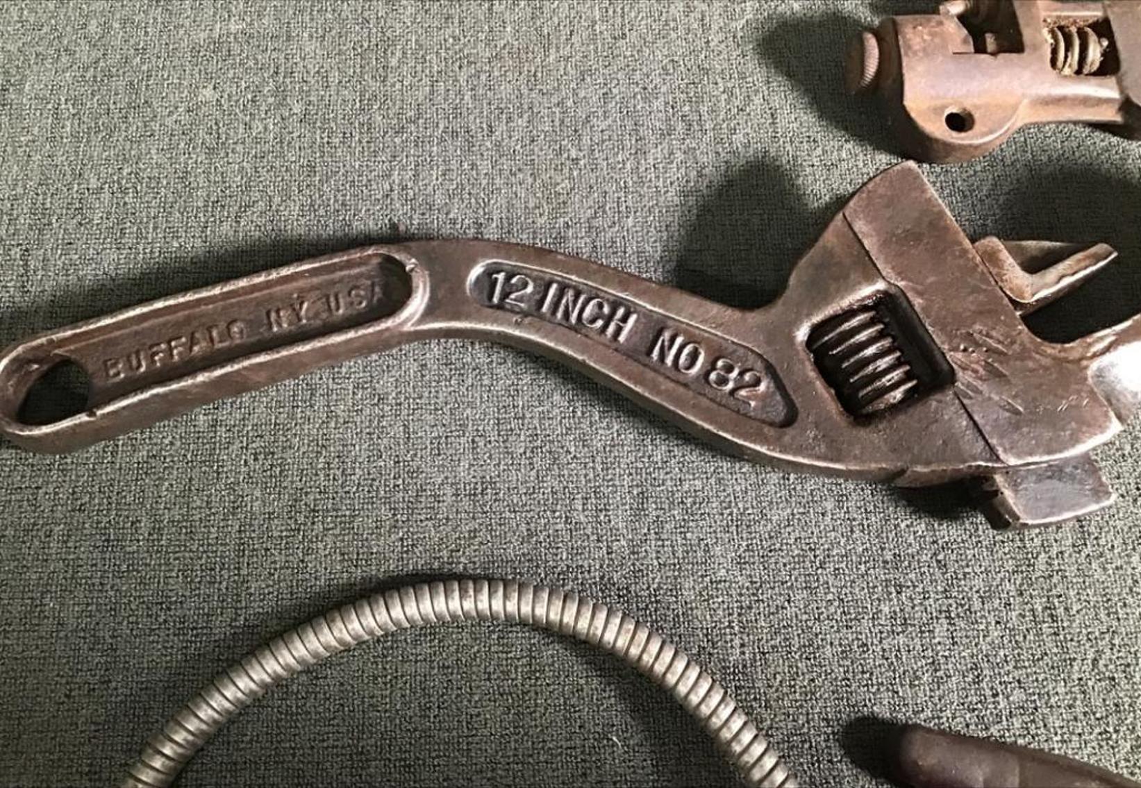 Image for Two Pipe Wrenches, Riveter, And Axe Head