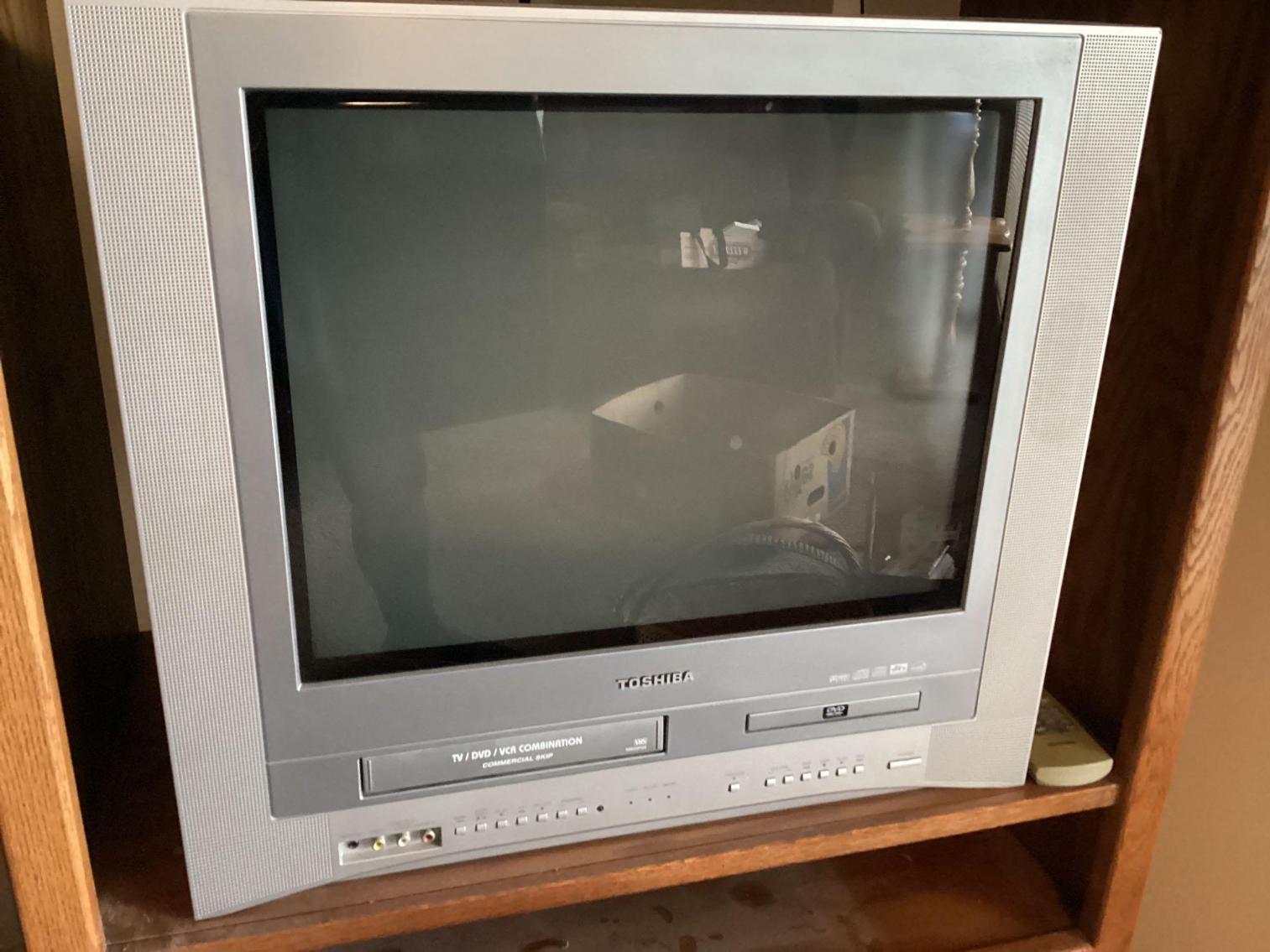 Image for Toshiba TV in Stand with VCR Tapes