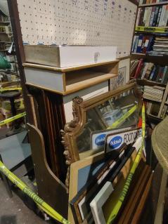 store-peg-board-display-numerous-framed-items-mirror-advertising
