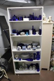 bookcase-blue-glass-items-various-blue-and-white-platters-cups-and-dishe