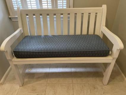 white-wooden-garden-bench-with-cushion