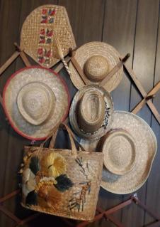 straw-hats-and-straw-bag-with-fan-and-hat-rack
