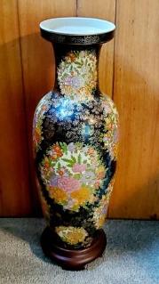 tall-ceramic-vase-on-wood-stand